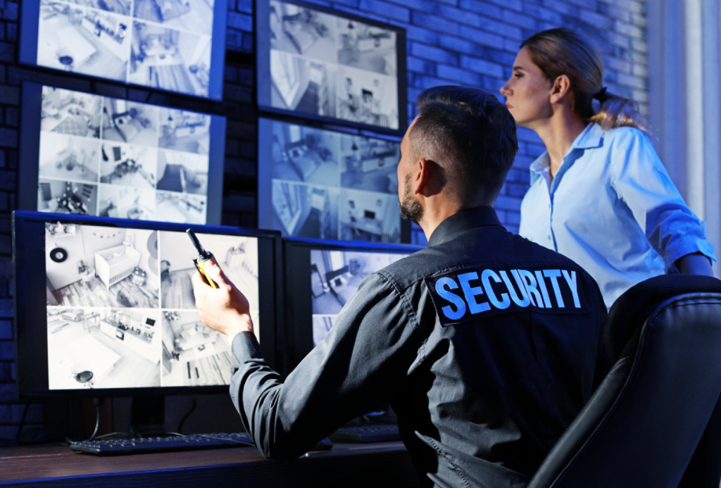 Security officer monitoring CCTV screens during a shift