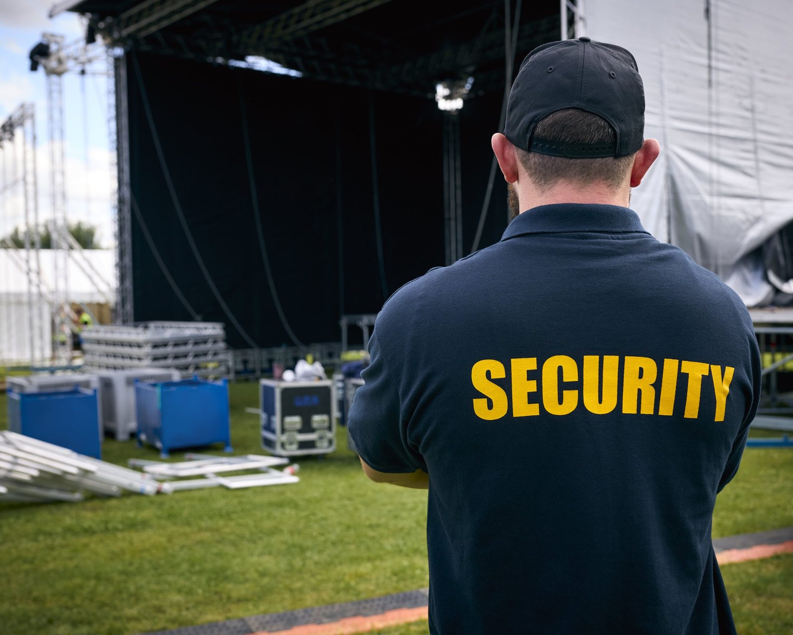 Event security officer overseeing an outdoor venue