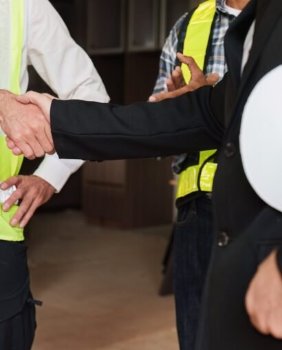 civil-construction-team-handshake-at-renovate-cons-2025-02-18-05-37-10-utc-min